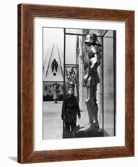 Little Boy Staring Up at Medieval Suit of Armor in the Metropolitan Museum of Art-Alfred Eisenstaedt-Framed Photographic Print