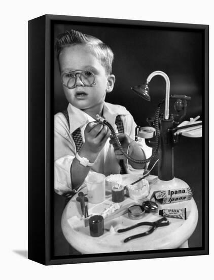 Little Boy with a Toy Dentist Set-Walter Sanders-Framed Premier Image Canvas