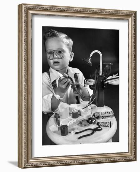 Little Boy with a Toy Dentist Set-Walter Sanders-Framed Photographic Print