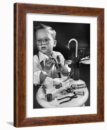 Little Boy with a Toy Dentist Set-Walter Sanders-Framed Photographic Print