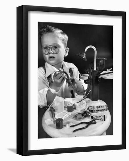 Little Boy with a Toy Dentist Set-Walter Sanders-Framed Photographic Print