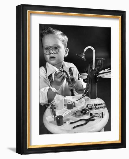 Little Boy with a Toy Dentist Set-Walter Sanders-Framed Photographic Print