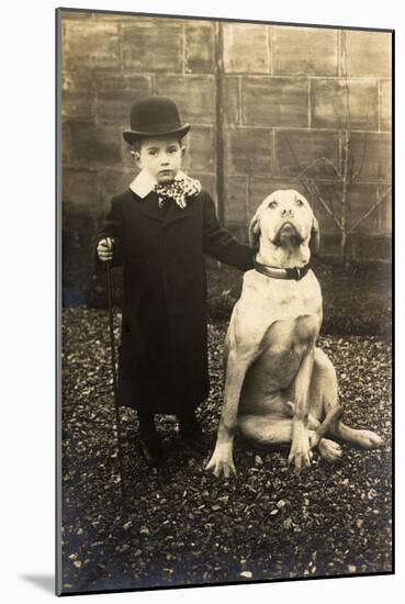 Little Boy with Large Bulldog in a Garden, France-null-Mounted Photographic Print