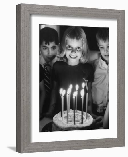 Little Girl Blowing Out Her Candles on Her Birthday Cake-Robert W^ Kelley-Framed Photographic Print