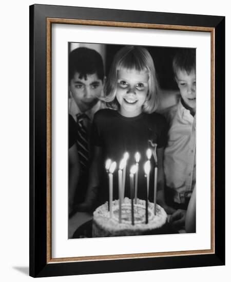 Little Girl Blowing Out Her Candles on Her Birthday Cake-Robert W^ Kelley-Framed Photographic Print