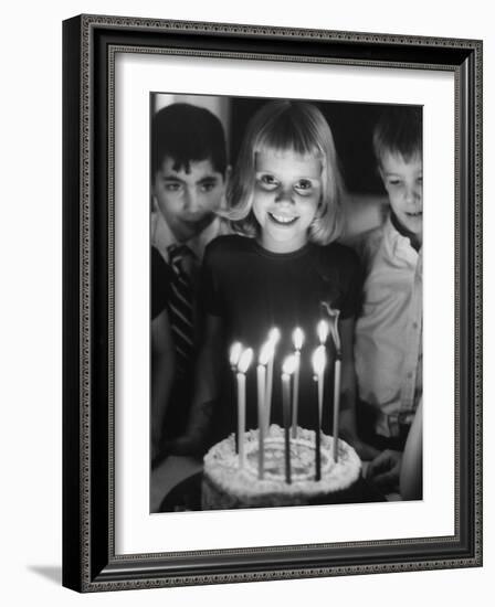 Little Girl Blowing Out Her Candles on Her Birthday Cake-Robert W^ Kelley-Framed Photographic Print