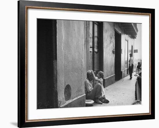 Little Girl Cleaning Face of a Street Beggar-null-Framed Photographic Print