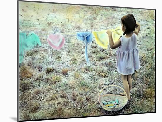 Little Girl Hanging Laundry-Nora Hernandez-Mounted Giclee Print