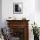 Little Girl in Hat and Coat Crouching Next to a Suitcase-null-Framed Photo displayed on a wall