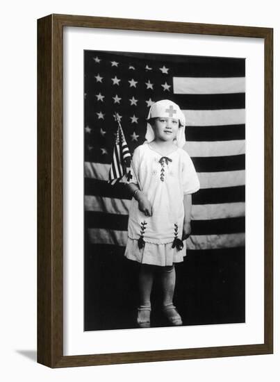 Little Girl in Nurses Outfit Holding US Flag-Lantern Press-Framed Art Print