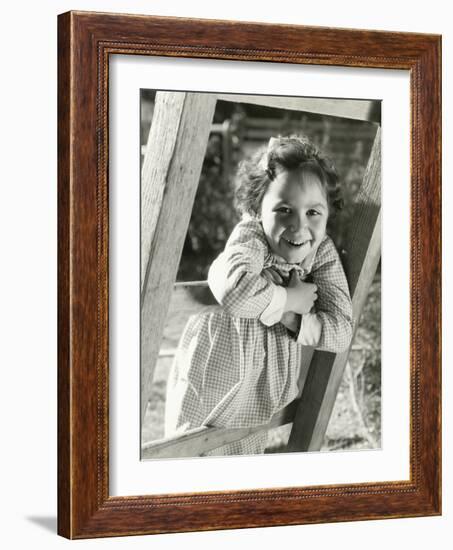 Little Girl Leaning on Ladder-null-Framed Photo