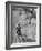 Little Girl Riding Her Tricycle, Leading Francis the Mule-Allan Grant-Framed Photographic Print