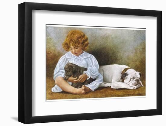 Little Girl Sits with a White Bulldog and Cuddles a Puppy-null-Framed Photographic Print