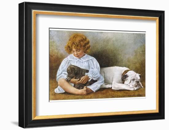 Little Girl Sits with a White Bulldog and Cuddles a Puppy-null-Framed Photographic Print