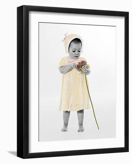 Little Girl Standing Holding a Sunflower-Nora Hernandez-Framed Giclee Print