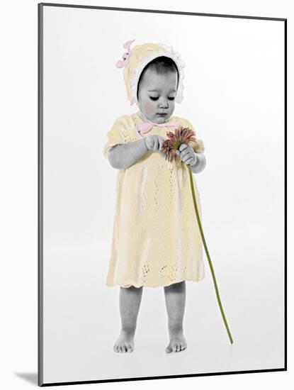 Little Girl Standing Holding a Sunflower-Nora Hernandez-Mounted Giclee Print