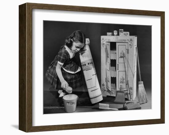 Little Girl with a Toy House Cleaning Kit-Walter Sanders-Framed Photographic Print