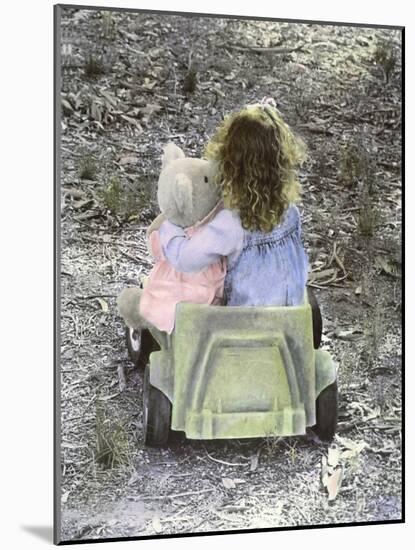 Little Girl with Her Teddy Bear Riding in a Toy Car-Nora Hernandez-Mounted Giclee Print