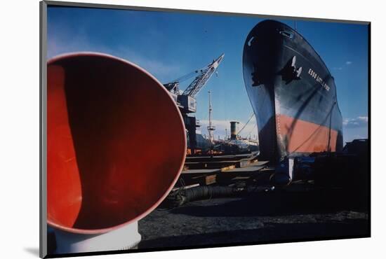 Little Rock Oil Tanker over Ship Ventilator Parts at Sun Shipbuilding and Dry Dock Co. Shipyards-Dmitri Kessel-Mounted Photographic Print