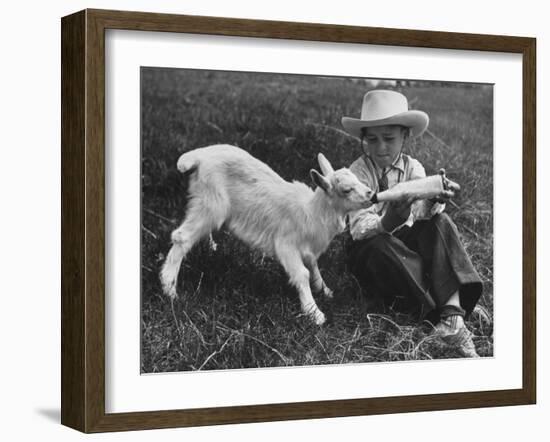 Little White Goat Being Fed from Bottle by Little Boy, at White Horse Ranch-William C^ Shrout-Framed Photographic Print