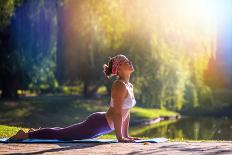 Young Woman Doing Yoga in Morning Park-lkoimages-Photographic Print