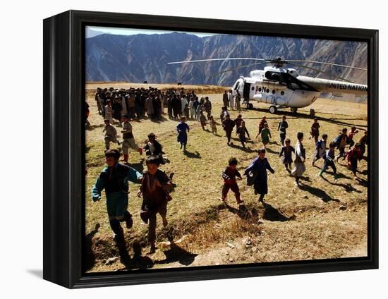 Local Children Run from a Helicopter-null-Framed Premier Image Canvas