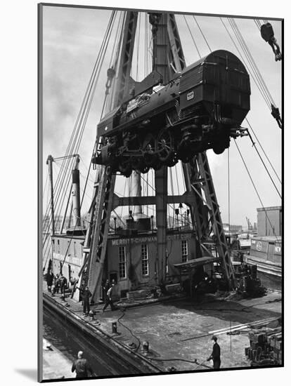 Locomotive Hoisted by Merritt-Chapman-Scott Crane Headed for France to Boost the Postwar Effort-Andreas Feininger-Mounted Photographic Print