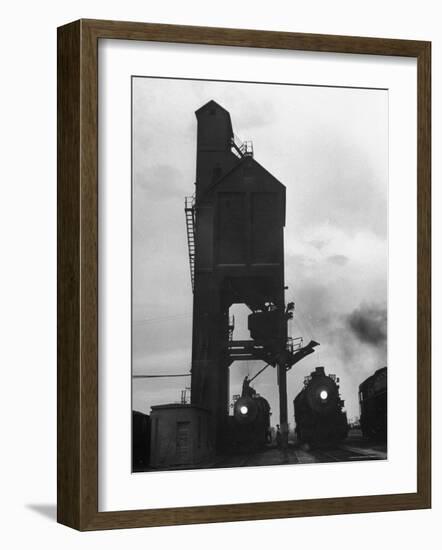 Locomotives Having Their Headlights Cleaned at Dusk-Peter Stackpole-Framed Photographic Print