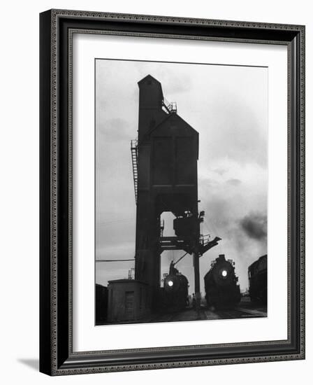 Locomotives Having Their Headlights Cleaned at Dusk-Peter Stackpole-Framed Photographic Print