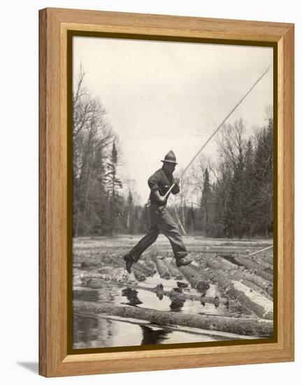 Log Driver Leaping Across Floating Logs to Keep Them Moving by Breaking Loose Any That Get Jammed-Margaret Bourke-White-Framed Premier Image Canvas