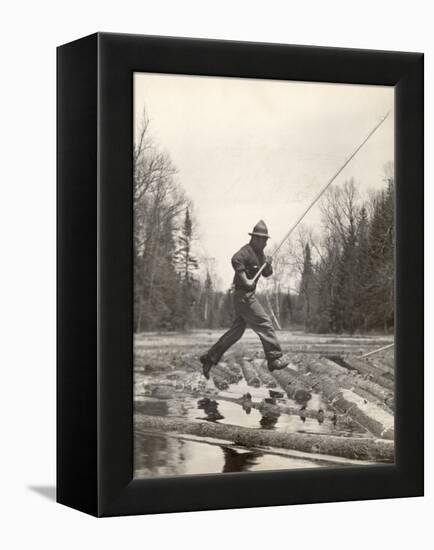 Log Driver Leaping Across Floating Logs to Keep Them Moving by Breaking Loose Any That Get Jammed-Margaret Bourke-White-Framed Premier Image Canvas