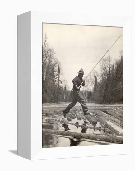 Log Driver Leaping Across Floating Logs to Keep Them Moving by Breaking Loose Any That Get Jammed-Margaret Bourke-White-Framed Premier Image Canvas