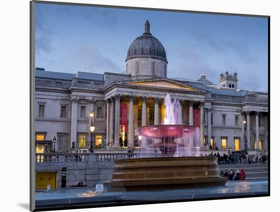 London National Gallery is illuminated at twilight with Trafalgar Square fountain-Charles Bowman-Mounted Photographic Print
