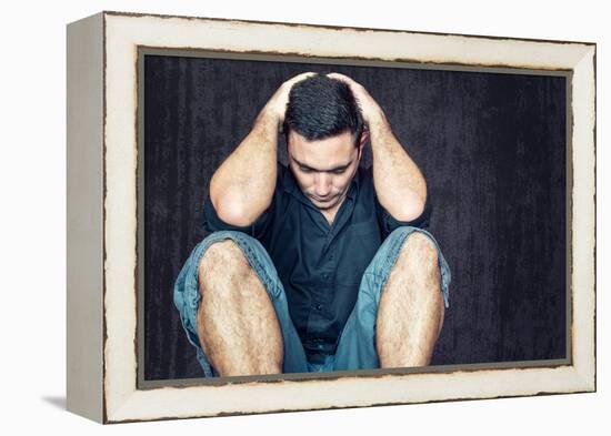 Lonely and Sad Young Man Sitting on the Floor with His Head between His Hands-Kamira-Framed Premier Image Canvas