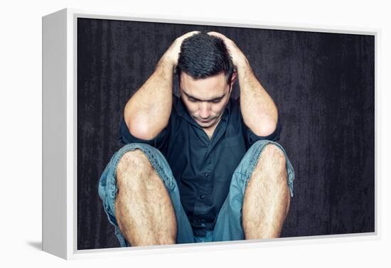 Lonely and Sad Young Man Sitting on the Floor with His Head between His Hands-Kamira-Framed Premier Image Canvas