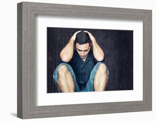 Lonely and Sad Young Man Sitting on the Floor with His Head between His Hands-Kamira-Framed Photographic Print