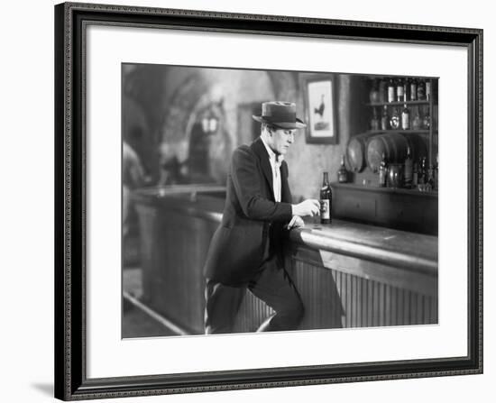 Lonely Man Standing at a Bar Counter with a Drink-null-Framed Photo