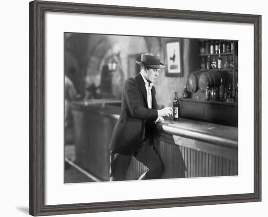Lonely Man Standing at a Bar Counter with a Drink-null-Framed Photo
