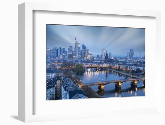 Long exposure of clouds at dusk over the illuminated city skyline and Ignatz Bubis bridge-Roberto Moiola-Framed Photographic Print