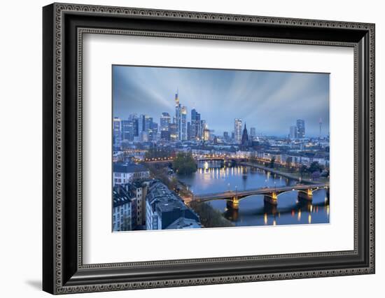 Long exposure of clouds at dusk over the illuminated city skyline and Ignatz Bubis bridge-Roberto Moiola-Framed Photographic Print