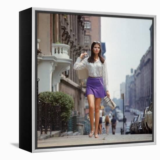 Long Hair Woman with short skirt, lace top and sandals walking up street in "New York Look" fashion-Vernon Merritt III-Framed Premier Image Canvas