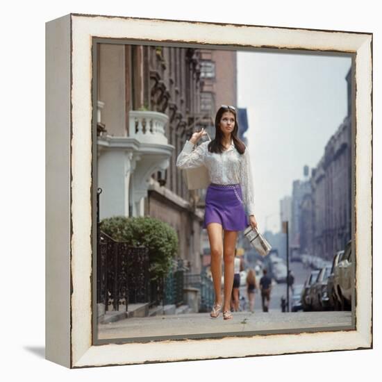 Long Hair Woman with short skirt, lace top and sandals walking up street in "New York Look" fashion-Vernon Merritt III-Framed Premier Image Canvas