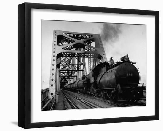 Long String of Tank Cars Rumbling Across the 4 1/2 Mile Huey Long Bridge at New Orleans-Peter Stackpole-Framed Photographic Print