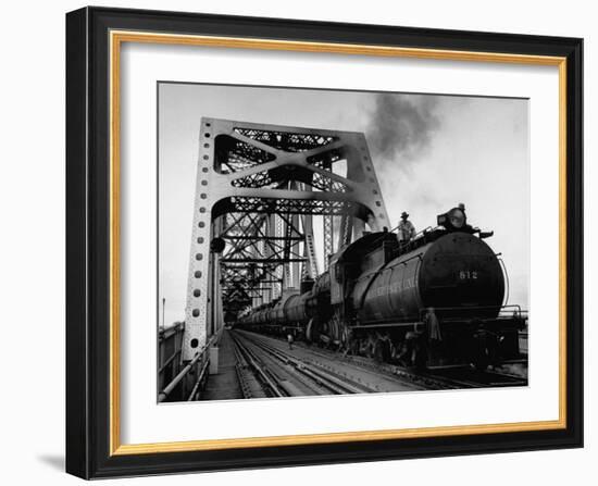 Long String of Tank Cars Rumbling Across the 4 1/2 Mile Huey Long Bridge at New Orleans-Peter Stackpole-Framed Photographic Print