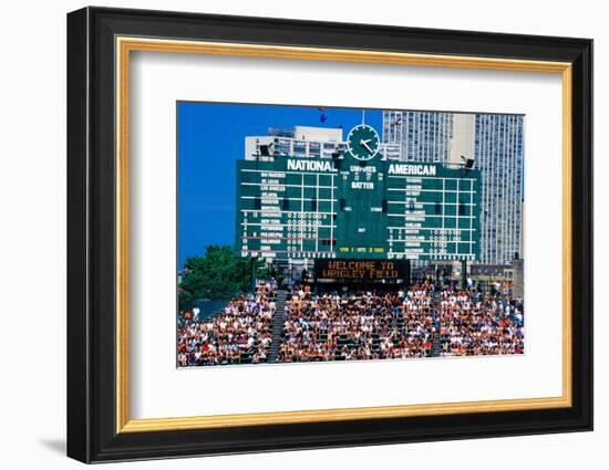 Long view of scoreboard and full bleachers during a professional baseball game, Wrigley Field, I...-null-Framed Photographic Print