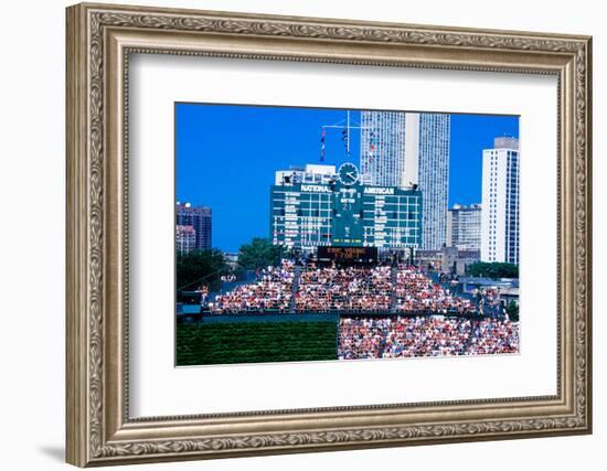 Long view of scoreboard and full bleachers during a professional baseball game, Wrigley Field, I...-null-Framed Photographic Print