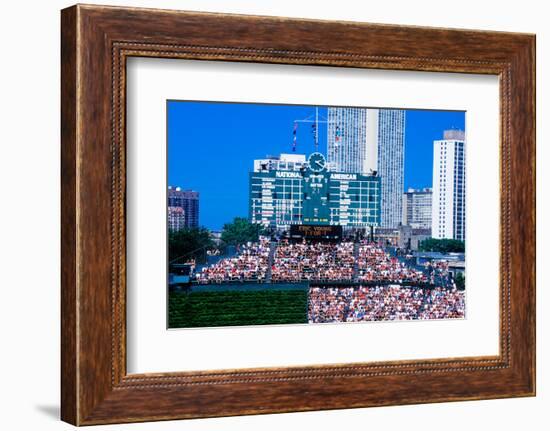 Long view of scoreboard and full bleachers during a professional baseball game, Wrigley Field, I...-null-Framed Photographic Print