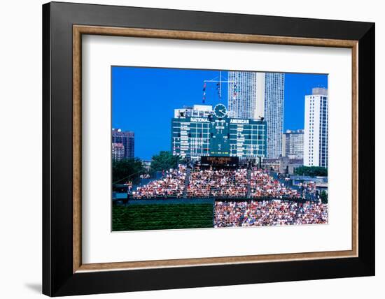 Long view of scoreboard and full bleachers during a professional baseball game, Wrigley Field, I...-null-Framed Photographic Print