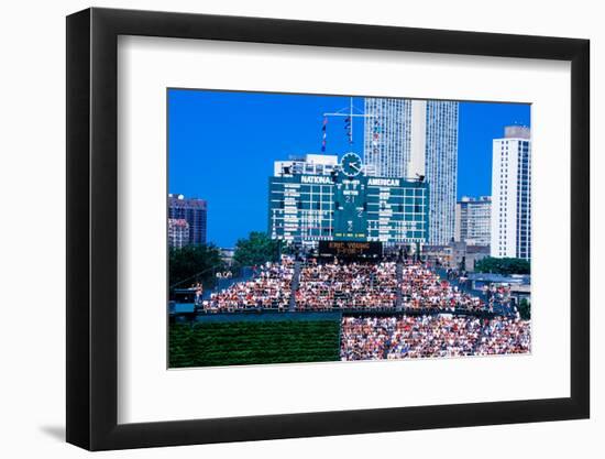 Long view of scoreboard and full bleachers during a professional baseball game, Wrigley Field, I...-null-Framed Photographic Print