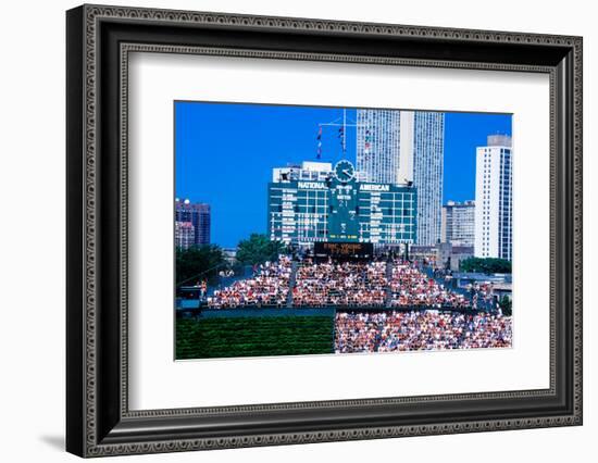 Long view of scoreboard and full bleachers during a professional baseball game, Wrigley Field, I...-null-Framed Photographic Print